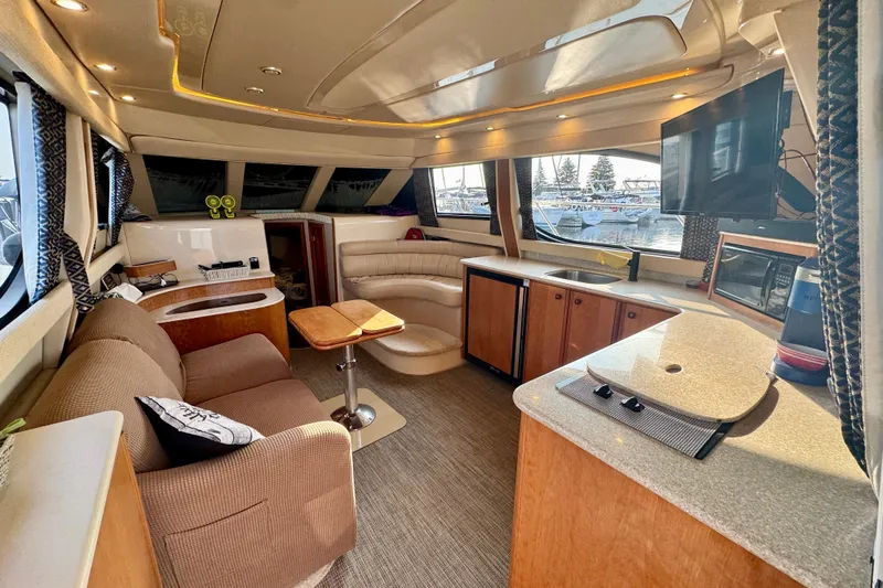  Yacht Photos Pics Luxurious interior of a 2003 Meridian 341 Sedan yacht with modern amenities.