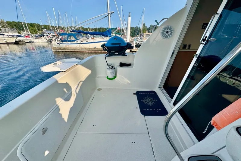  Yacht Photos Pics 2003 Meridian 341 Sedan boat deck with grill, docked at marina.