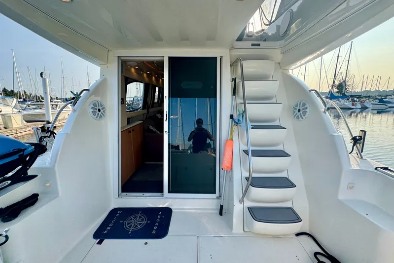  Yacht Photos Pics 2003 Meridian 341 Sedan yacht interior with stairs and marina view.