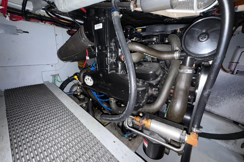  Yacht Photos Pics Engine compartment of a 2003 Meridian 341 Sedan boat, showcasing mechanical components.