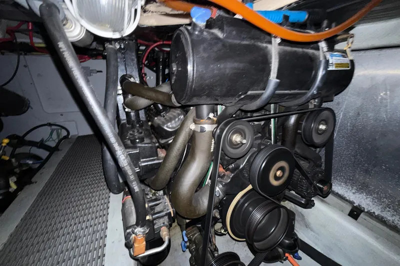  Yacht Photos Pics Engine compartment of a 2003 Meridian 341 Sedan, showcasing belts and hoses.