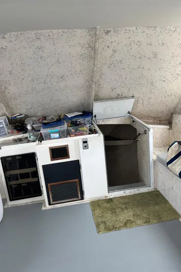  Yacht Photos Pics 2006 Island Hopper Sportfisher interior with storage compartments and equipment.