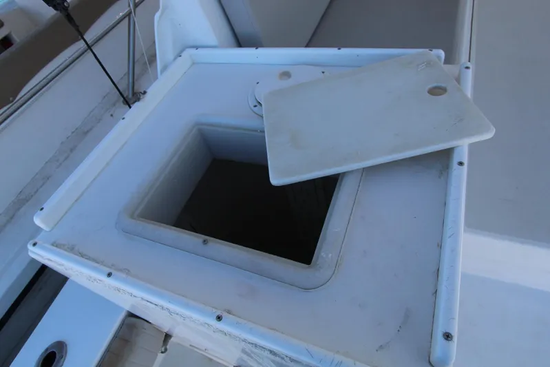  Yacht Photos Pics Open storage compartment on 2006 Island Hopper Sportfisher boat deck.