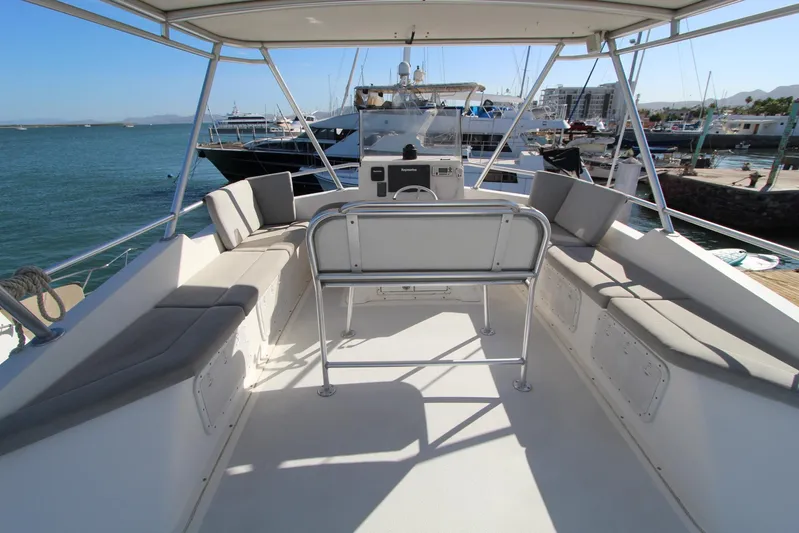  Yacht Photos Pics 2006 Island Hopper Sportfisher boat deck with seating, docked at marina.