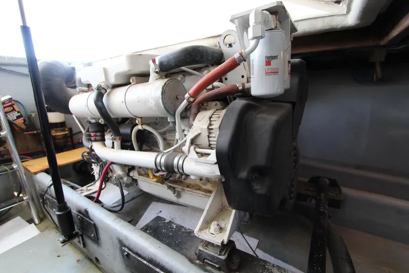  Yacht Photos Pics Engine compartment of a 2006 Island Hopper Sportfisher boat, showcasing mechanical components.