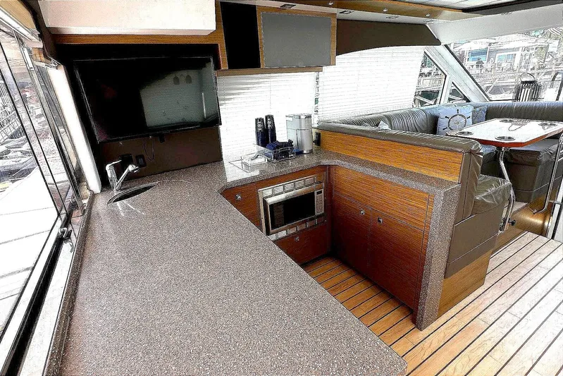  Yacht Photos Pics Interior of 2014 Cruisers Yachts 45 Cantius with modern kitchen and seating area.