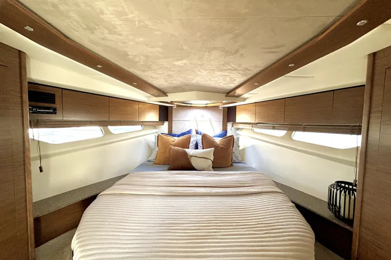  Yacht Photos Pics Luxurious cabin interior of 2014 Cruisers Yachts 45 Cantius with cozy bedding.