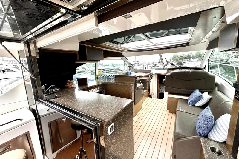  Yacht Photos Pics 2014 Cruisers Yachts 45 Cantius interior with modern design and spacious seating area.