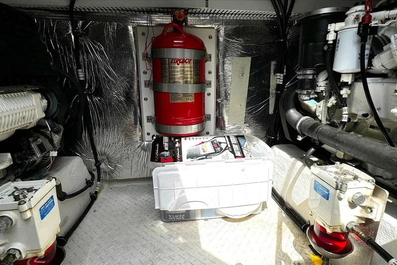  Yacht Photos Pics Engine room of 2014 Cruisers Yachts 45 Cantius with fire suppression system and equipment.