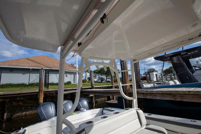 Evil Tequila Yacht Photos Pics 2015 Yellowfin 39 Offshore boat interior with seating and dock view.