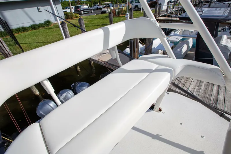 Evil Tequila Yacht Photos Pics 2015 Yellowfin 39 Offshore boat with white seating and docked at marina.