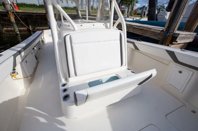 Evil Tequila Yacht Photos Pics 2015 Yellowfin 39 Offshore boat interior with white seating and storage compartments.