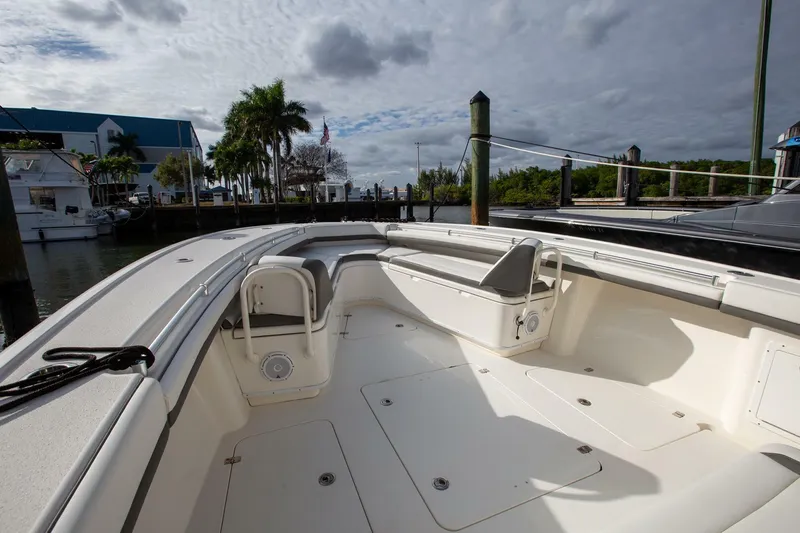 Evil Tequila Yacht Photos Pics 2015 Yellowfin 39 Offshore boat docked, featuring spacious deck and seating area.