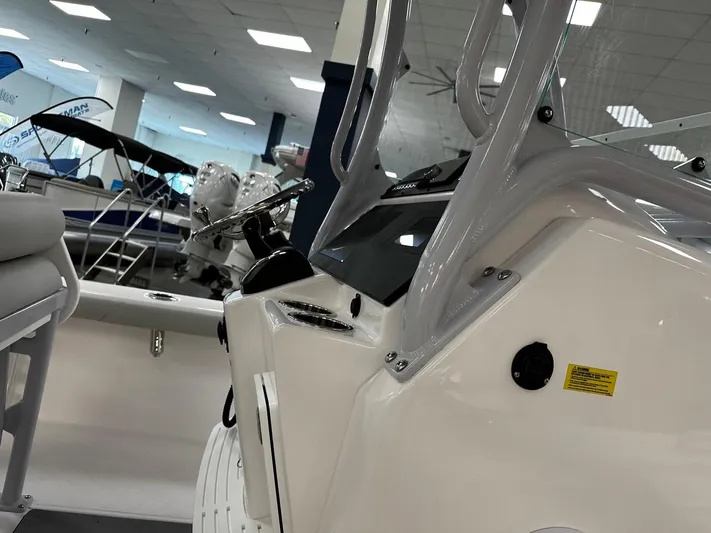  Yacht Photos Pics 2023 Everglades 243 Center Console boat interior with steering wheel and seating.