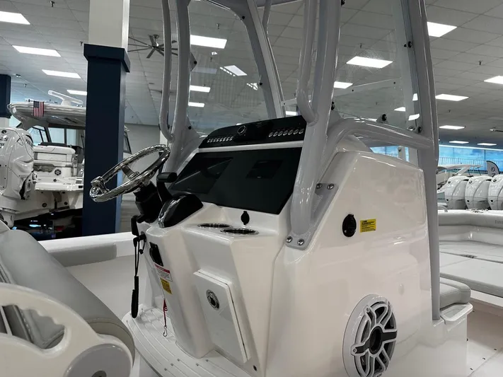  Yacht Photos Pics 2023 Everglades 243 Center Console boat interior with steering wheel and control panel.