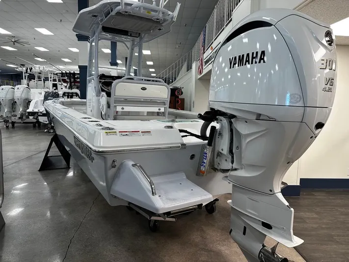  Yacht Photos Pics 2023 Everglades 243 Center Console boat with Yamaha 300 V6 engine in showroom.