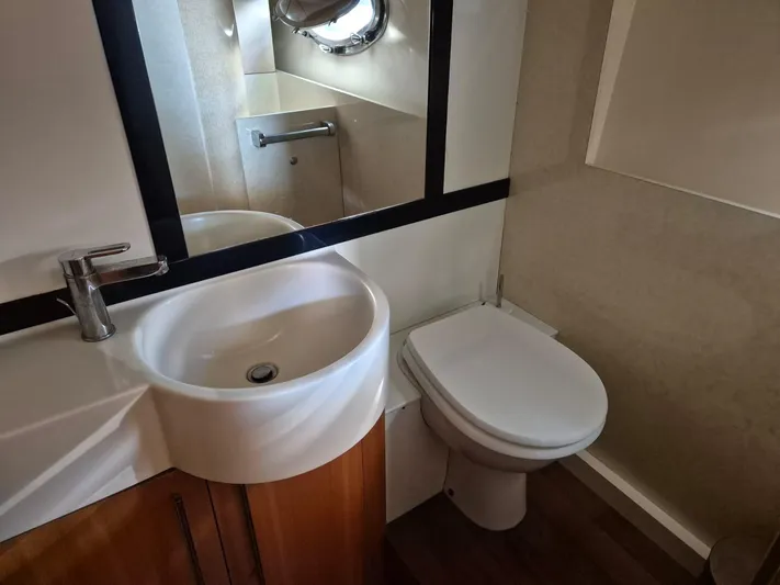  Yacht Photos Pics Bathroom interior of 1998 Riva Dolce Vita yacht with sink and toilet.