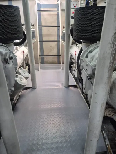  Yacht Photos Pics Engine room of a 1998 Riva Dolce Vita yacht, featuring dual engines and control panels.