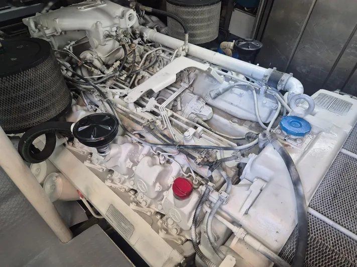  Yacht Photos Pics Engine of a 1998 Riva Dolce Vita boat, showcasing intricate mechanical components.