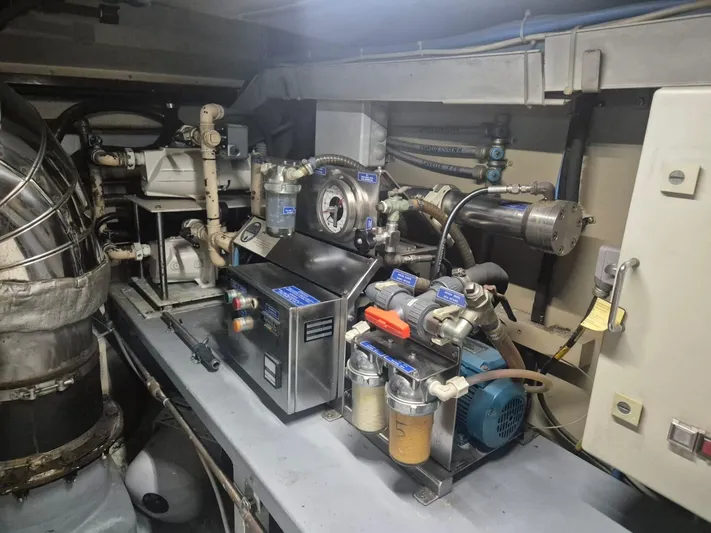  Yacht Photos Pics Engine room of a 1998 Riva Dolce Vita yacht, showcasing mechanical components and equipment.