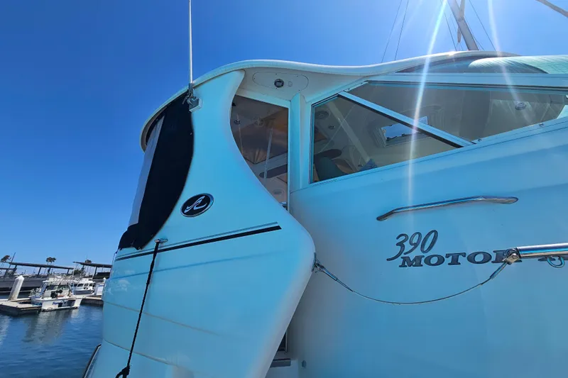 Reflections Yacht Photos Pics 2005 Sea Ray 390 Motor Yacht docked under clear blue sky.