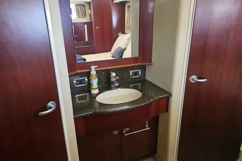 Reflections Yacht Photos Pics Luxurious bathroom in 2005 Sea Ray 390 Motor Yacht with elegant wood cabinetry.