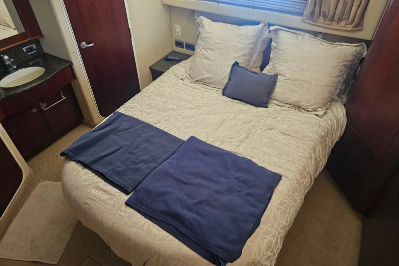 Reflections Yacht Photos Pics Luxurious bedroom interior of 2005 Sea Ray 390 Motor Yacht with elegant bedding.