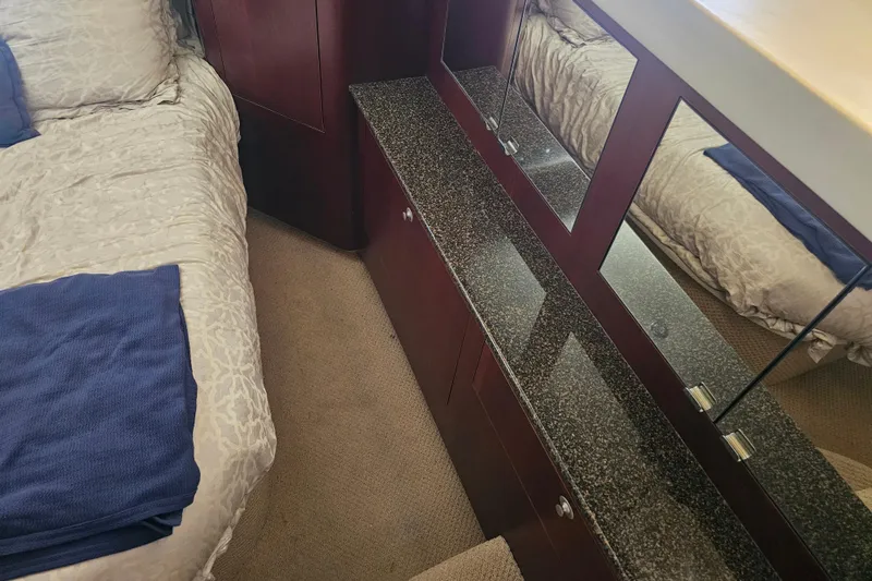 Reflections Yacht Photos Pics Interior of 2005 Sea Ray 390 Motor Yacht with bed and mirrored cabinet.