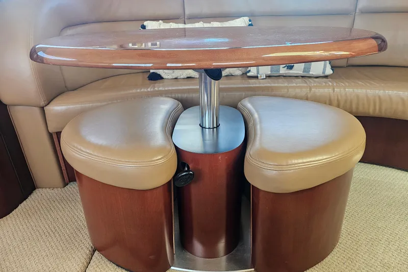 Reflections Yacht Photos Pics Interior of 2005 Sea Ray 390 Motor Yacht with elegant seating and table.