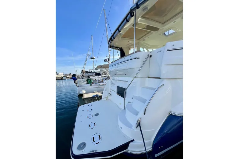 Reflections Yacht Photos Pics 2005 Sea Ray 390 Motor Yacht docked, showcasing rear deck and steps.