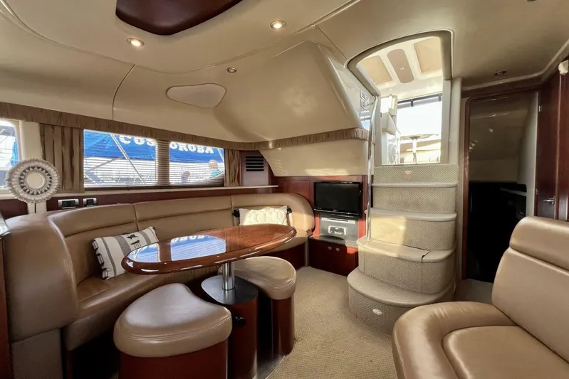 Reflections Yacht Photos Pics Luxurious interior of 2005 Sea Ray 390 Motor Yacht with elegant seating and dining area.