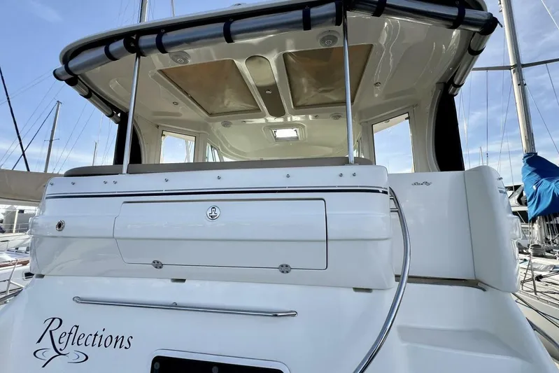 Reflections Yacht Photos Pics 2005 Sea Ray 390 Motor Yacht, rear view, docked with "Reflections" name visible.