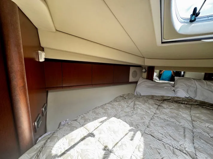 Gloria Yacht Photos Pics Interior cabin of 2007 Sea Ray 40 Sundancer yacht with bed and window.