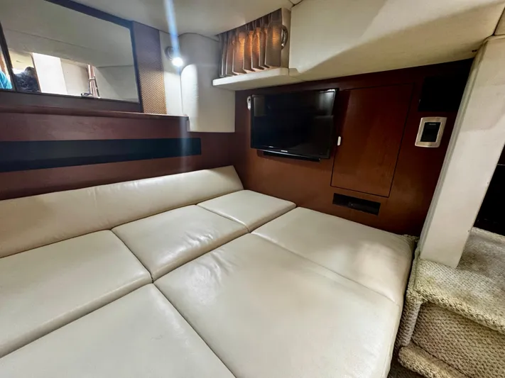Gloria Yacht Photos Pics Interior of 2007 Sea Ray 40 Sundancer with leather seating and wall-mounted TV.