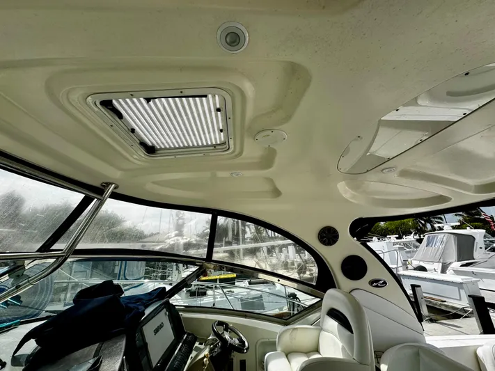 Gloria Yacht Photos Pics Interior view of 2007 Sea Ray 40 Sundancer yacht, featuring helm and seating area.