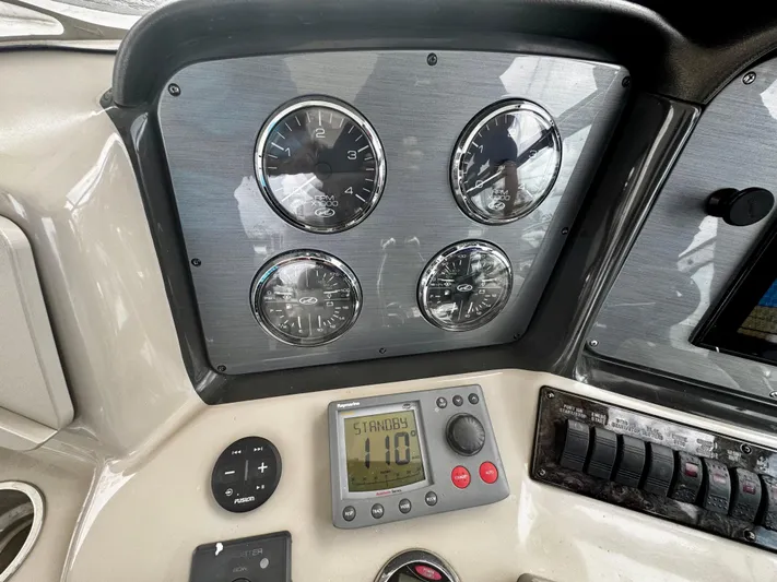 Gloria Yacht Photos Pics Dashboard of a 2007 Sea Ray 40 Sundancer boat with gauges and controls.