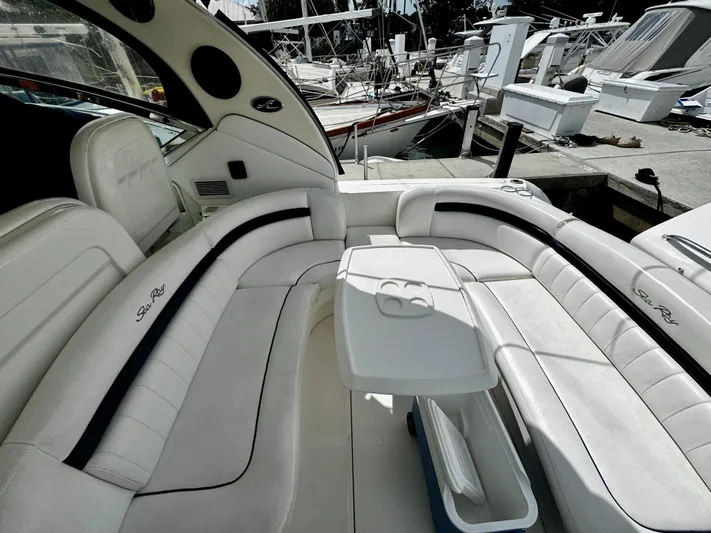 Gloria Yacht Photos Pics Luxurious seating area on a 2007 Sea Ray 40 Sundancer yacht at a marina.