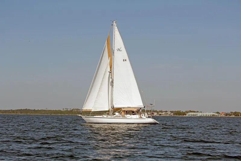 Legacy Yacht Photos Pics Sailing yacht Hylas 49CC 2012 gliding on open water under clear skies.