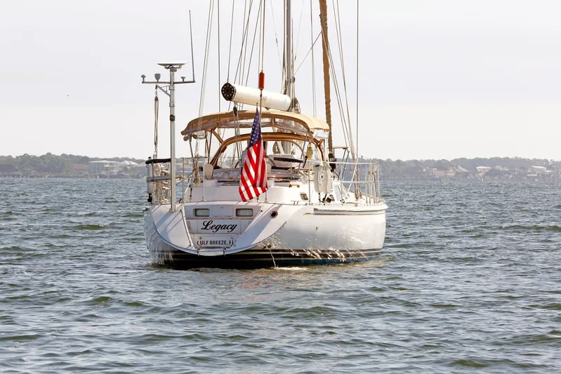 Legacy Yacht Photos Pics Sailboat "Legacy" on water, Hylas 49CC, 2012 model, with American flag.