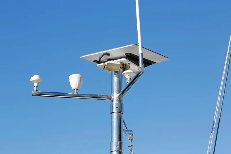 Legacy Yacht Photos Pics Mast equipment on 2012 Hylas 49CC sailboat against clear blue sky.