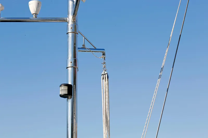 Legacy Yacht Photos Pics Stainless steel rigging on 2012 Hylas 49CC sailboat against clear blue sky.