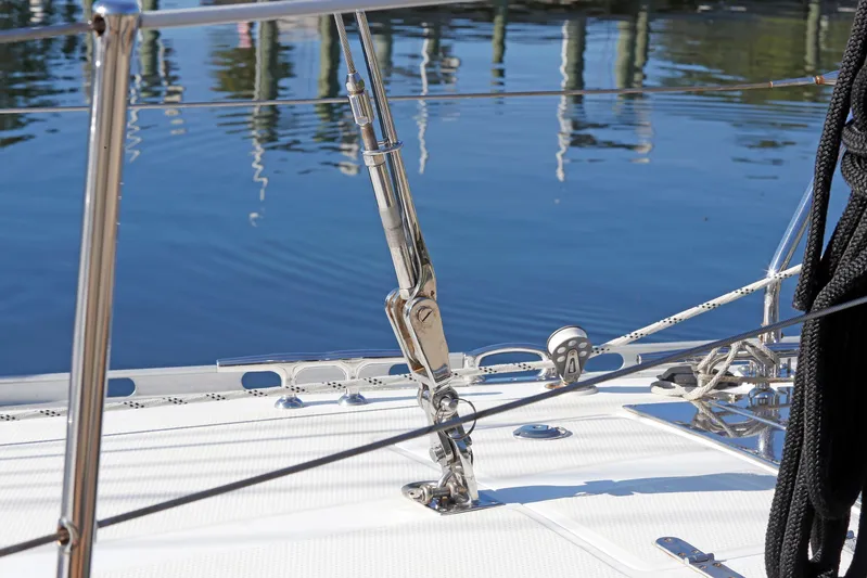 Legacy Yacht Photos Pics Deck of 2012 Hylas 49CC sailboat with rigging and calm water reflection.