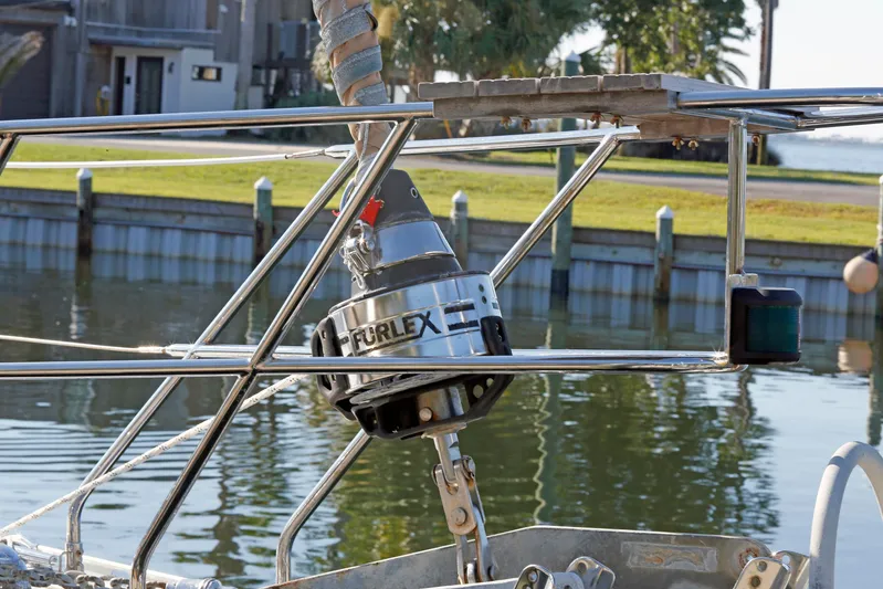 Legacy Yacht Photos Pics Stainless steel furling system on a 2012 Hylas 49CC sailboat by the water.