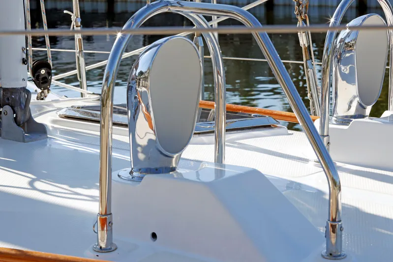 Legacy Yacht Photos Pics Polished deck details of a 2012 Hylas 49CC yacht, featuring chrome fittings and sleek design.