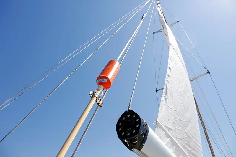 Legacy Yacht Photos Pics Sailboat mast and rigging of 2012 Hylas 49CC against clear blue sky.