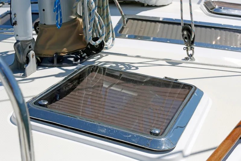 Legacy Yacht Photos Pics Deck of 2012 Hylas 49CC yacht with ropes and hatch detail.