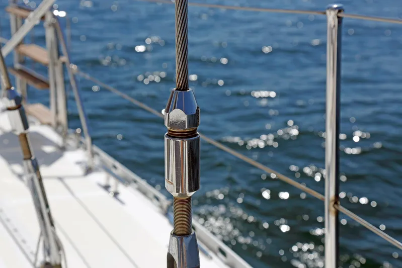 Legacy Yacht Photos Pics Close-up of a Hylas 49CC yacht's rigging against a sparkling ocean backdrop, 2012 model.