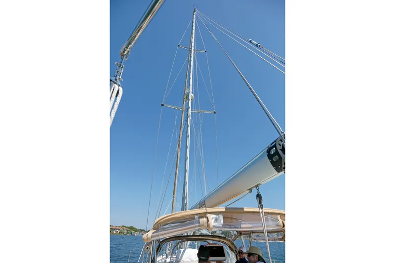 Legacy Yacht Photos Pics Sailboat mast and rigging on a 2012 Hylas 49CC under clear blue sky.