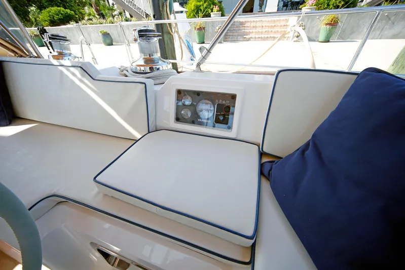 Legacy Yacht Photos Pics Luxurious seating area on a 2012 Hylas 49CC yacht with control panel.