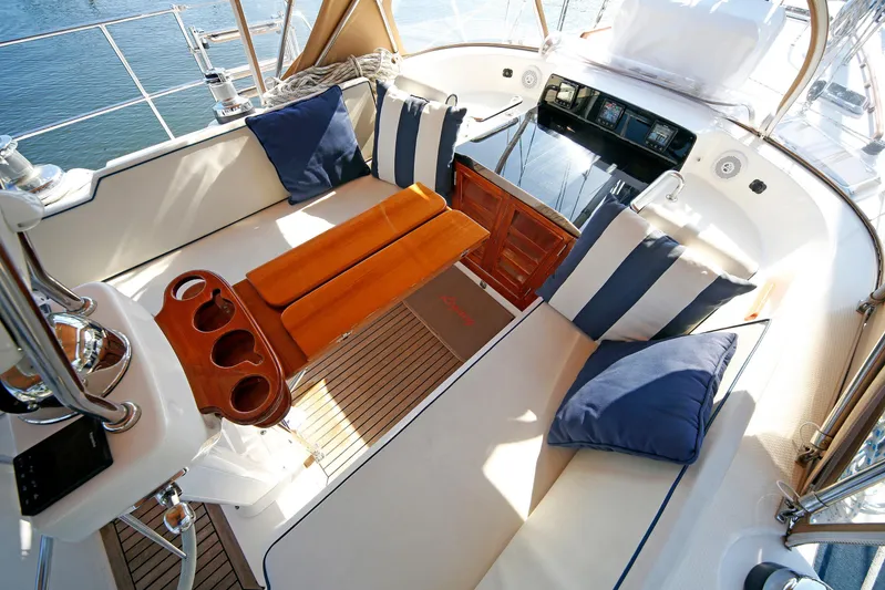 Legacy Yacht Photos Pics Luxurious 2012 Hylas 49CC yacht cockpit with cushioned seating and elegant wood accents.